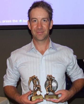 Ben Thomas with his two key trophies - 4000 runs and 200 games.
