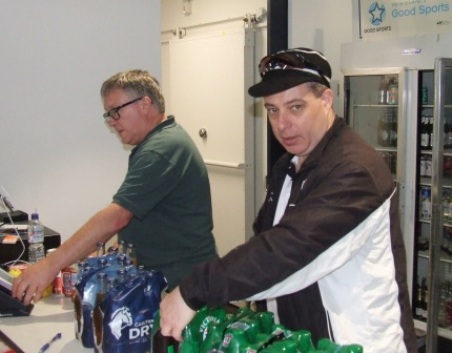 A well-stocked bar - with committee members Peter Golding (left) and Daniel Phillips hard at work.
