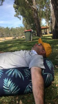 All too much after a hard day at the cricket: Michael Cumbo asleep at Thompson's Beach on the Murray.