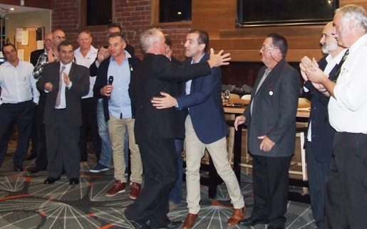 Welcome to our select group: Sean O'Kane receives a hug from fellow Life Member Jim Polonidis (right)