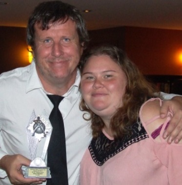 Gun fielder Shaun Rayment with yet another award - and with partner Lara.