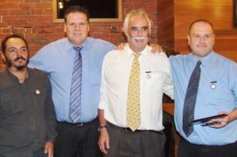 Proud: New Life Member Peter Smith (far right) with (L-R) his long-time captain Danny Terzini, brother Geoff Smith and President Charlie Walker.