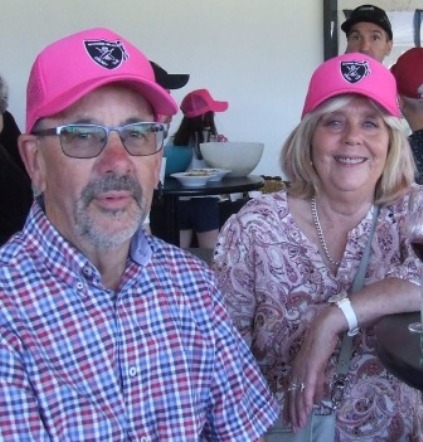 Alan and Sandra Thomas proudly wear the special Moonee Valley caps made up for the Tien Polonidis fundraiser.