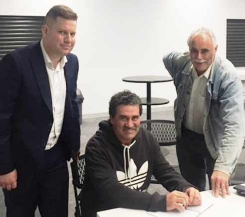 Our latest signing: (from left) Carlton premiership captain Sam Walker with coach Tony Gleeson and president Charlie Walker.