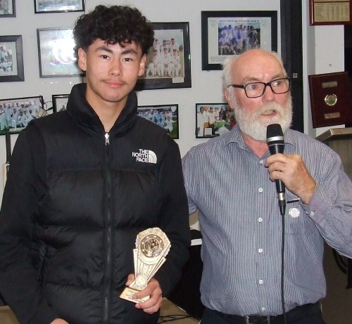 Oscar McKeown receives his Wicketkeeper of the Year award from Allan Cumming (far right).