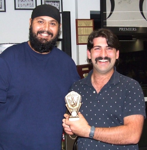 Ben Baldacchino (far right) receives his Fourths fielding award from captain Manu Singh.