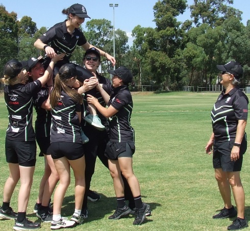 Up there Cazaly! Sarah Fenn is hoisted to the shoulders of her teammates while Sandra Verschoor watches on.