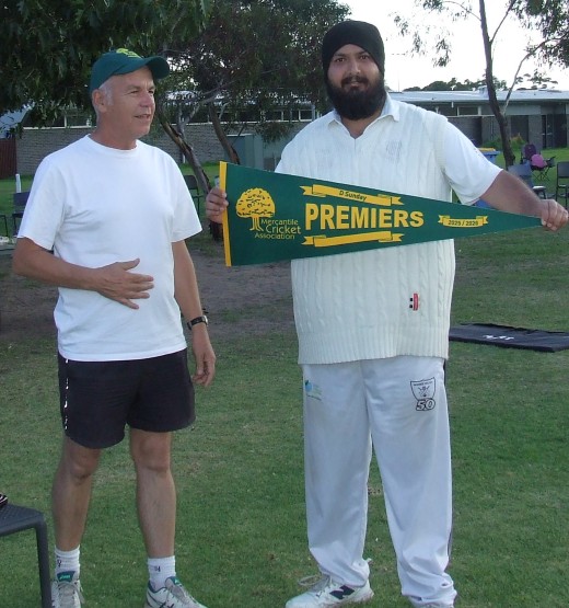 Captain Manu Singh (far right) receives the Premiership pennant from Mercantile Secretary Rhidian Thomas.