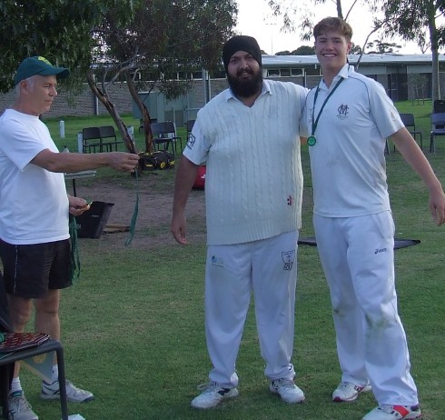 David Lubansky (far right) is congratulated by captain Manu Singh (middle) and Mercantile Secretary Rhidian Thomas.