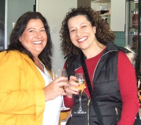 Natalie Demarte (left) and Agatha Jukic enjoy a wine.