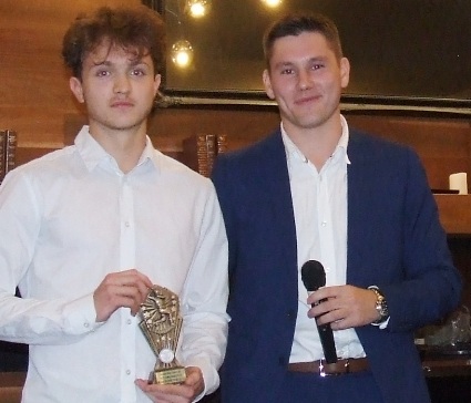 Dejan Gilevski (left) receives his bowling award from Firsts captain Jack Newman.