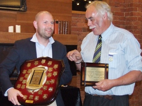 Dominic Rettino (left) with the Lindsay Jones shield and club president Charlie Walker with Dom's plaque.