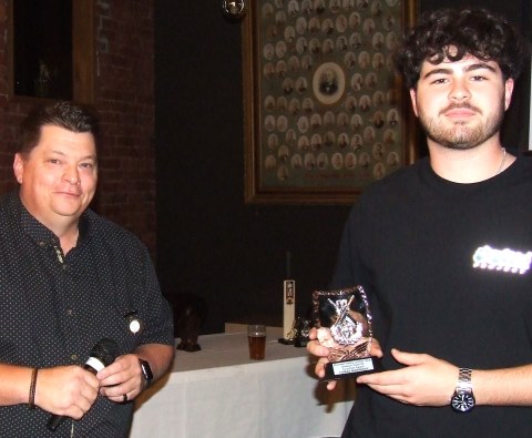 Coach Mark Gauci (left) presents the Coach's Award for Most Improved to Tom Morrissy.