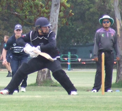 Brayden McGregor plays a late cut - watched by umpire Marcus Lee.