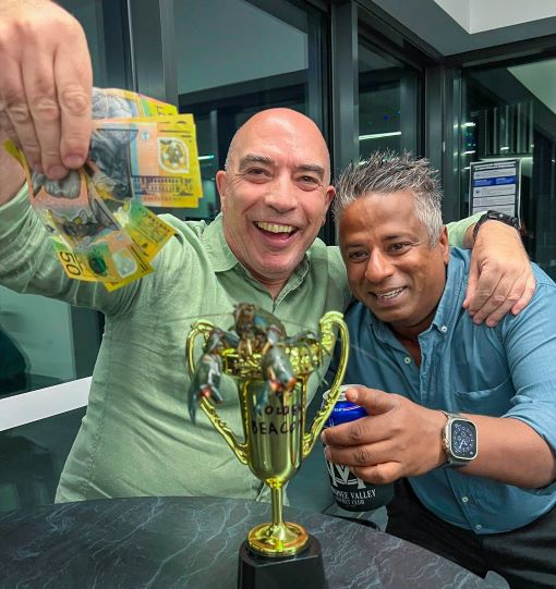 John Talone (left) was the owner of the winning yabby. Serial pest Sai Vivekananthan helps him celebrate.
