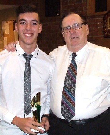 Nigel Cowan Snr presented the coach's award to son Nigel Jnr in 2018.