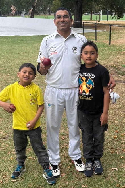 Sudarshan Devkota with his five-for ball, with sons Swakrit (left) and Swatit.