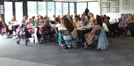 Members of the gathering listen intently to the guest speakers at the Moonee Valley Cricket Club Tien Polonidis Ladies Day.