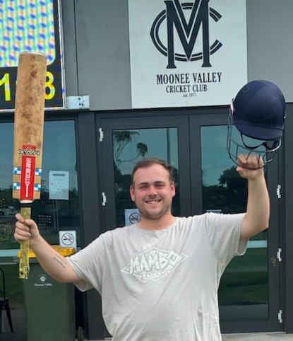 Lachlan Smith raises his bat for his maiden century.