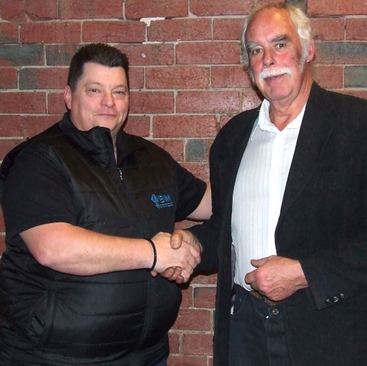 Newly-elected Moonee Valley Cricket Club President Mark Gauci (left) congratulates his predecessor Charlie Walker.